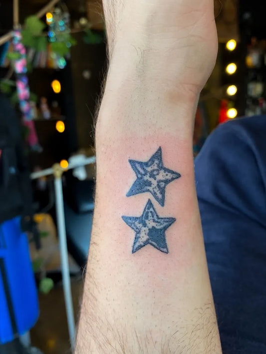 Small Fine Line Star Tattoo on Men Wrist by @spider___tattoo