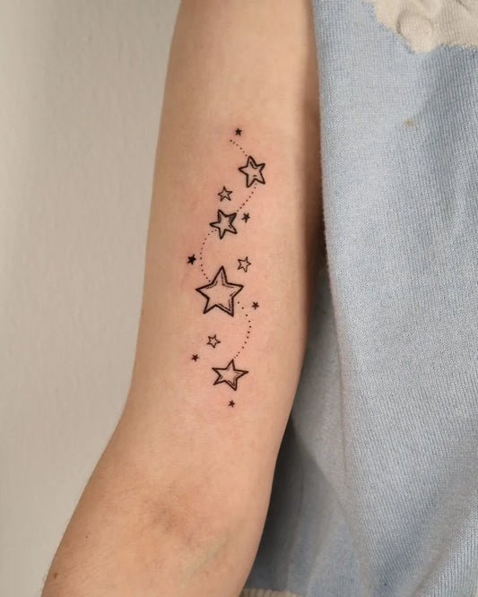 Small Fine Line Star Tattoo on Women Arm by @geeumtattoo