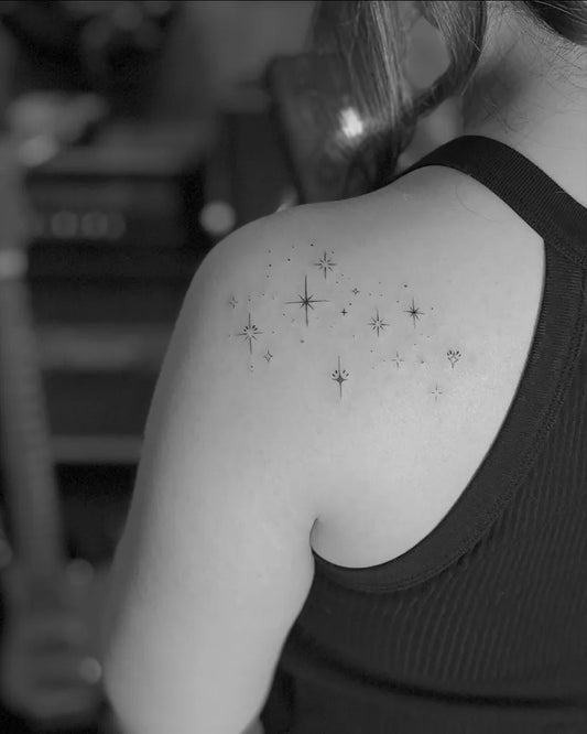Small Fine Line Stars Tattoo on Women Shoulder by @tattoo_sss_sandra