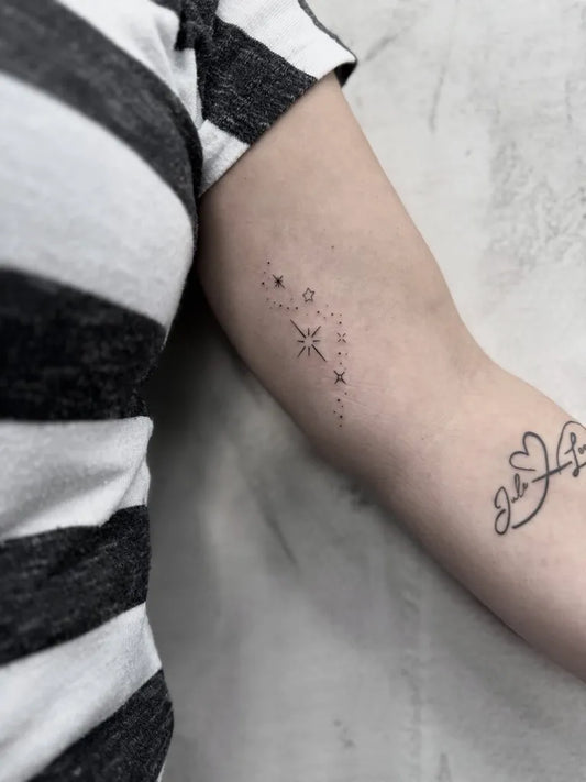 Small Fine Line Stars and Script Tattoo on Women Arm by @katilala.tattoo