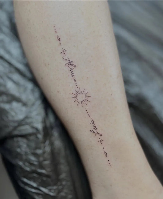 Small Fine Line Sun Name Script on Women Leg Tattoo by @sina.welcher.kosmetik.tattoo
