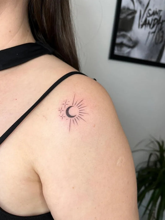 Small Fine Line Sun and Moon Tattoo on Women Shoulder by @bee.inktattoo