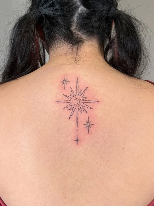 Small Fine Line Sun and Stars on Women Back Tattoo by @mu.uutat