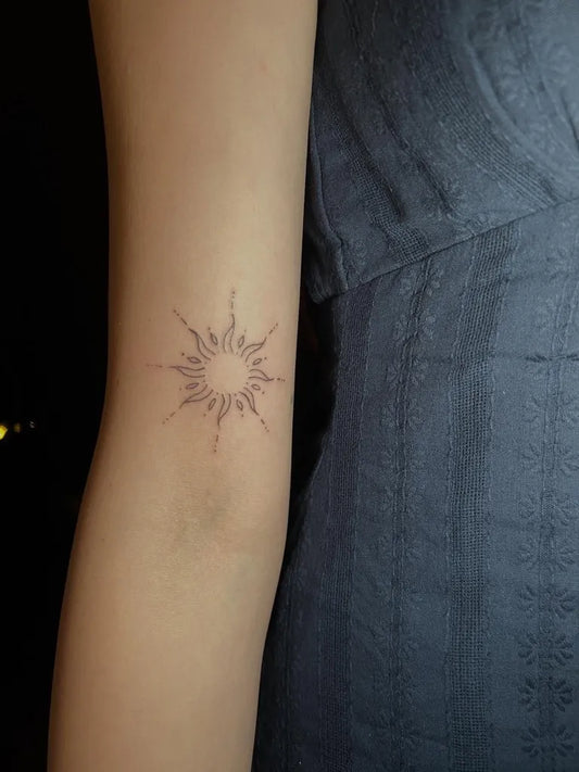 Small Fine Line Sun on Women Arm Tattoo by @kostudiocreates