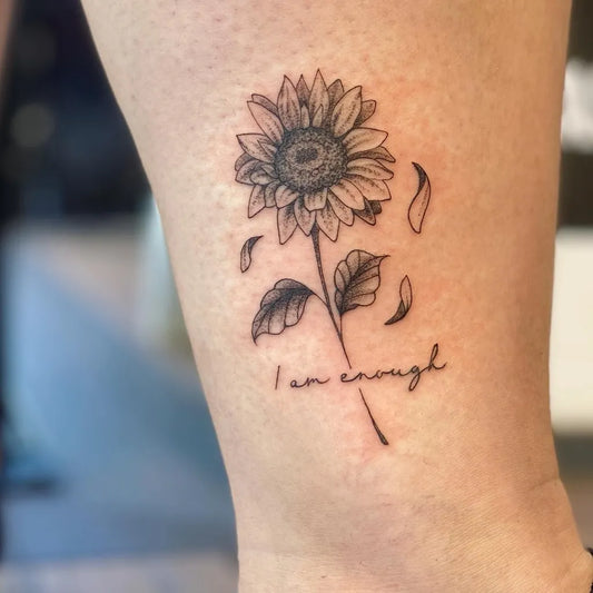 Small Fine Line Sunflower I Am Enough Tattoo on Women Ankle by @blackspadetattoo