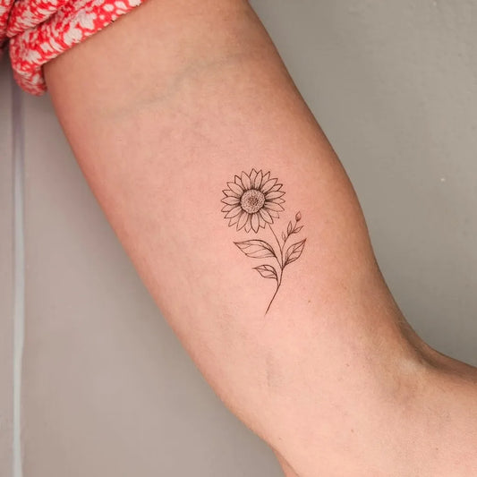 Small Fine Line Sunflower and Stem on Women Arm Tattoo by @m.art_tattoo