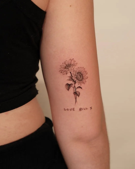 Small Fine Line Sunflower and Text on Women Arm Tattoo by @hungbun98.thehangoutstudio