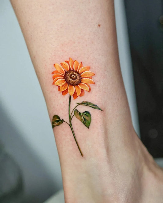 Small Fine Line Sunflower on Women Ankle Tattoo by @_rony_tattoo