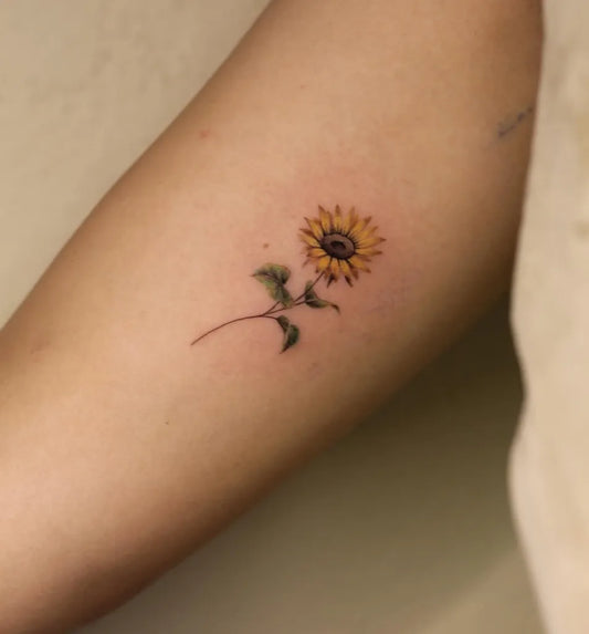 Small Fine Line Sunflower on Women Arm Tattoo by @angelmorales.j