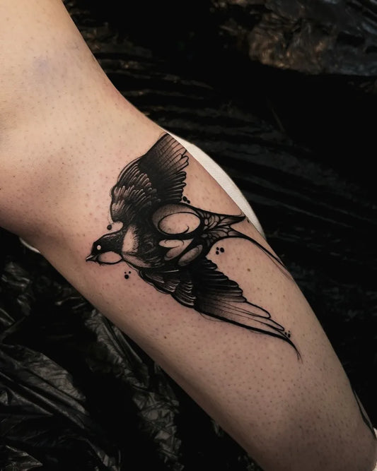 Small Fine Line Swallow Bird Tattoo on Women Arm by @kirsten.tattoo