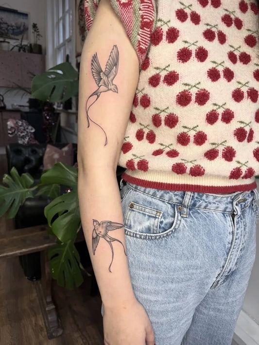 Small Fine Line Swallow Tattoo on Women Arm by @hoperosie