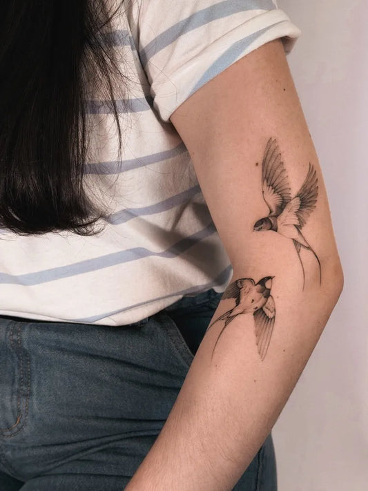 Small Fine Line Swallow Tattoo on Women Arm by @vinicioslira