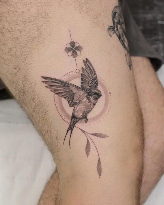 Small Fine Line Swallow and Clover Tattoo on Men Thigh by @kyla_rose_tattoo