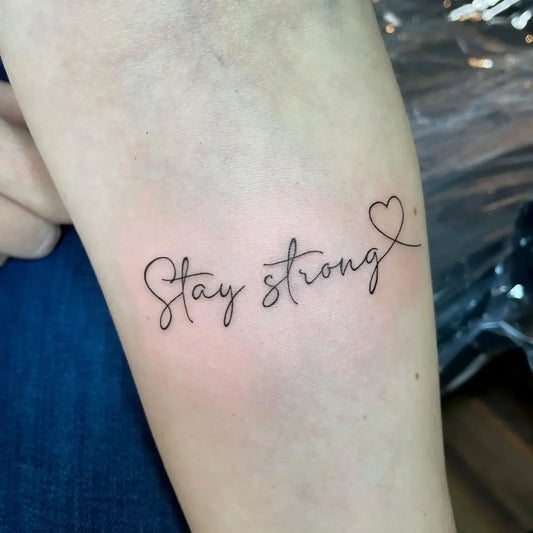 Small Fine Line Text Heart Quote Tattoo on Women Forearm by @natkatattoo