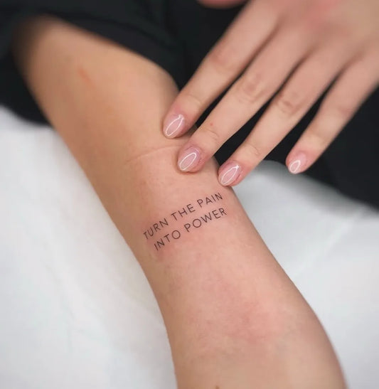 Small Fine Line Text Quote Tattoo on Women Wrist by @sailorstattoomilano