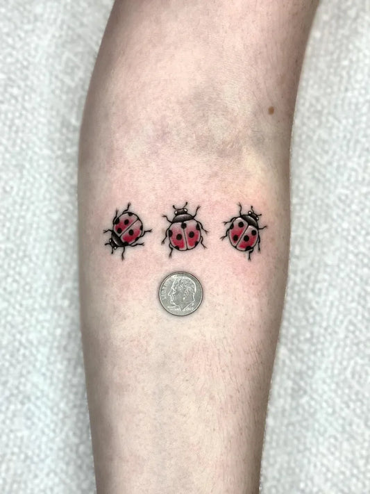Small Fine Line Three Ladybugs Tattoo on Women Forearm by @mercyraintattoos