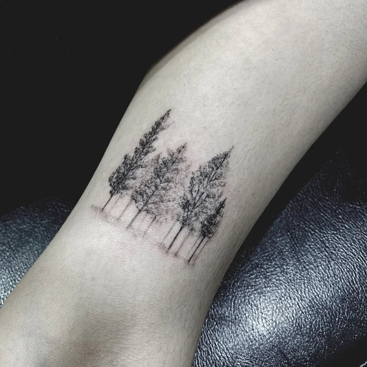 Small Fine Line Trees Tattoo on Women Arm by @tattoogo_studio