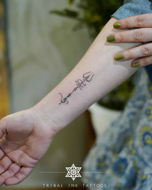 Small Fine Line Trishul Sanskrit Script on Women Forearm Tattoo by @tribalinktattoos