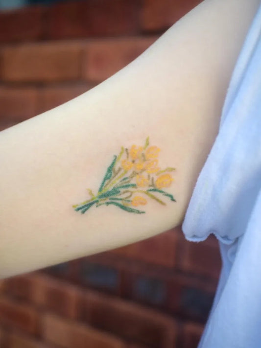 Small Fine Line Tulip Bouquet Tattoo on Women Upper Arm by @mimtt.poke