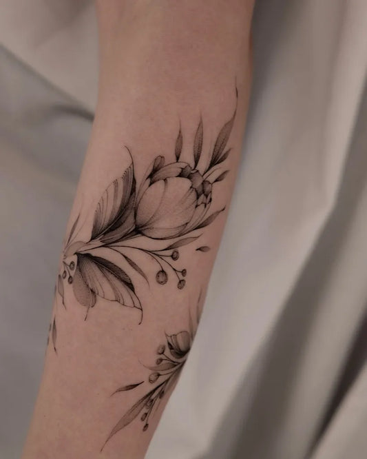 Small Fine Line Tulip Flowers Tattoo on Women Forearm by @black.peony.ink