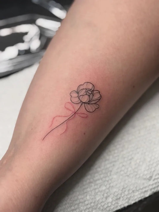 Small Fine Line Tulip Tattoo on Women Arm by @_snoeflinga_