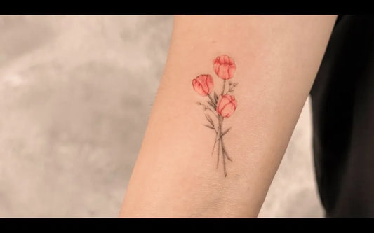 Small Fine Line Tulip Tattoo on Women Forearm by @tm_tat_