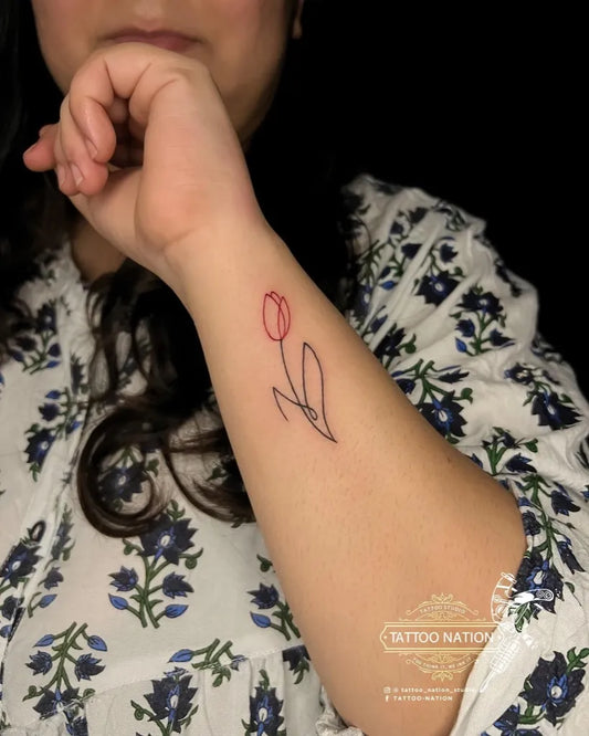 Small Fine Line Tulip Women Wrist by @tattoo_nation_studio