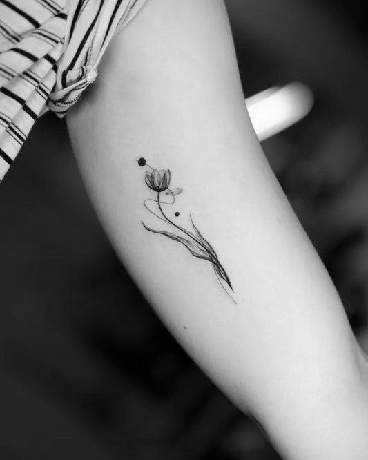 Small Fine Line Tulip and Dots Tattoo on Women Arm by @willfinchdesign