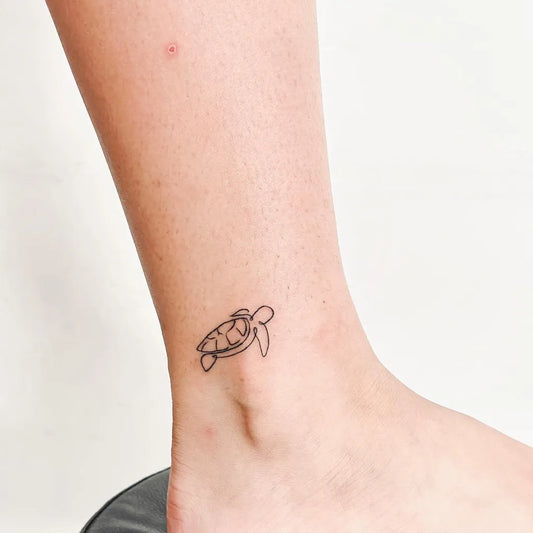 Small Fine Line Turtle Tattoo on Women Ankle by @nasarastudio