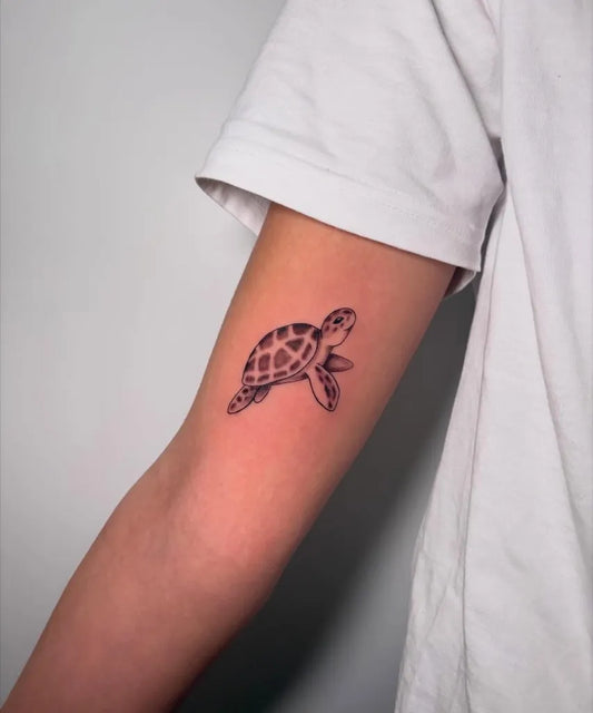 Small Fine Line Turtle Tattoo on Women Arm by @alice.cecchini