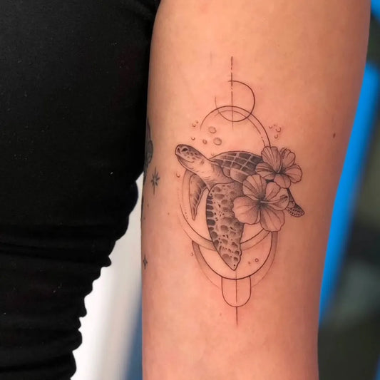 Small Fine Line Turtle and Hibiscus Tattoo on Women Arm by @blueblood_tattoo_kohsamui