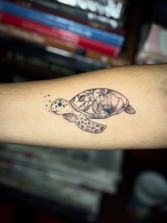 Small Fine Line Turtle with Flowers Tattoo on Women Forearm by @paulo_borrega