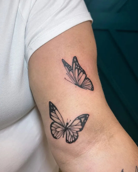 Small Fine Line Two Butterflies on Women Upper Arm Tattoo by @amandanicole_ink