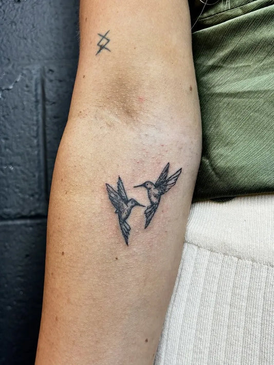 Small Fine Line Two Hummingbirds Tattoo on Women Forearm by @liljtatts