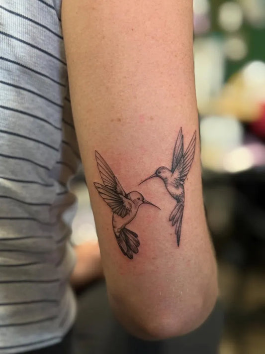 Small Fine Line Two Hummingbirds on Women Arm Tattoo by @cinthya_tattoos