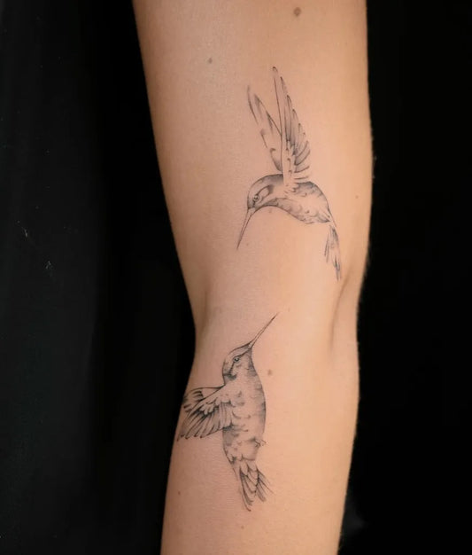 Small Fine Line Two Hummingbirds on Women Arm Tattoo by @poking.tiger
