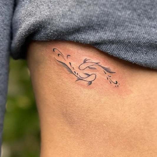 Small Fine Line Two Koi Fish Tattoo on Women Rib by @inkscooltattoos