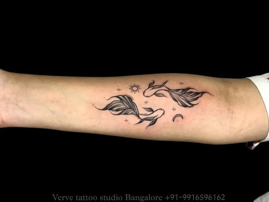 Small Fine Line Two Koi Fish and Crescent Moon Tattoo on Women Forearm by @vervetattoostudio