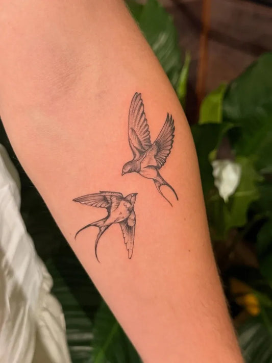 Small Fine Line Two Sparrows Tattoo on Women Arm by @hastingssttattoo