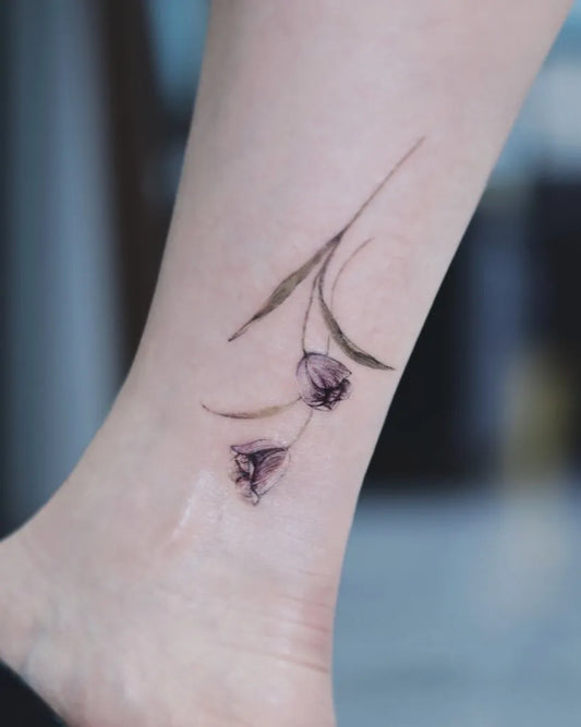 Small Fine Line Two Tulips Tattoo on Women Ankle by @matt_tattooist