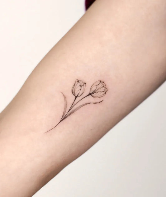 Small Fine Line Two Tulips Tattoo on Women Arm by @champ.arttt