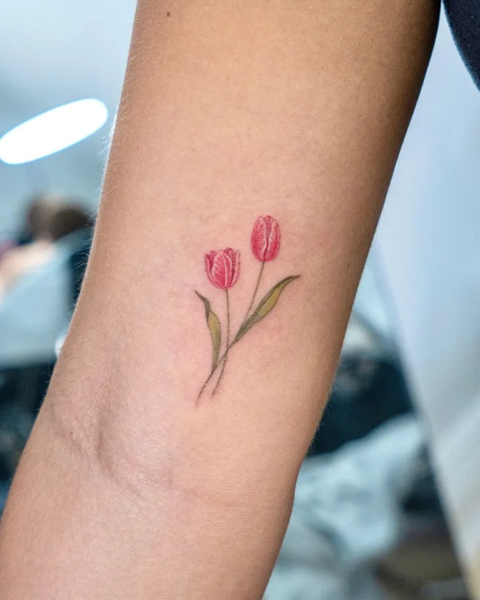 Small Fine Line Two Tulips Tattoo on Women Arm by @zia_tattoo