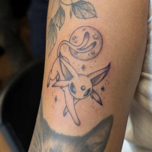 Small Fine Line Umbreon Tattoo on Women Arm by @hearthcreativestudios
