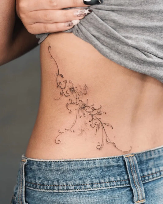 Small Fine Line Vine Flower on Women Side Tattoo by @popink.tokyo