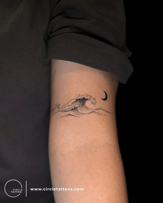 Small Fine Line Wave Moon Tattoo on Women Arm by @circletattoodadar