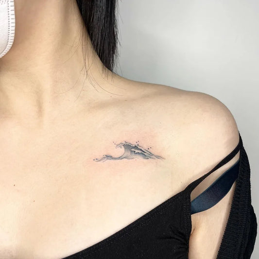 Small Fine Line Wave Tattoo on Women Shoulder by @hawol_tattoo