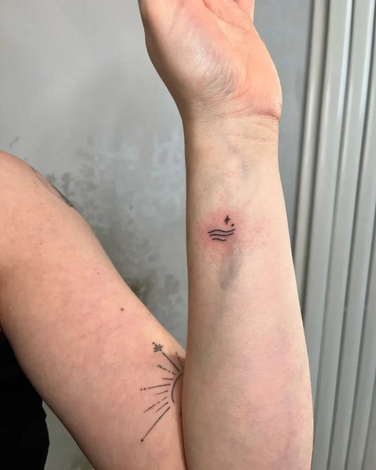 Small Fine Line Wave and Compass Tattoo on Women Wrist by @authenticallyinked_michaela