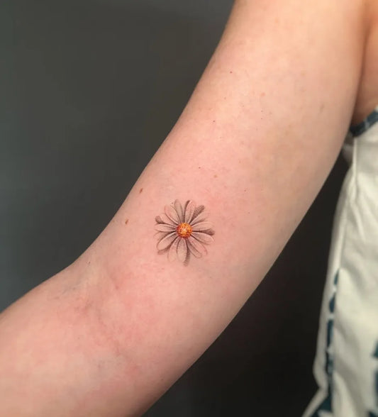 Small Fine Line White Daisy Tattoo on Women Arm by @viviana_pennati_tattoo