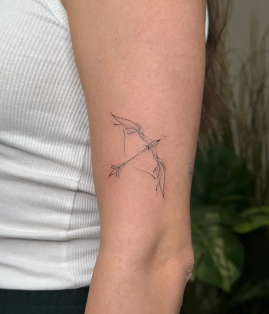 Small Fine Line Winged Arrow Tattoo on Women Arm by @tatti_ptc