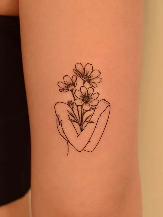 Small Fine Line Woman Embracing Flowers on Women Arm Tattoo by @tattooer_jina